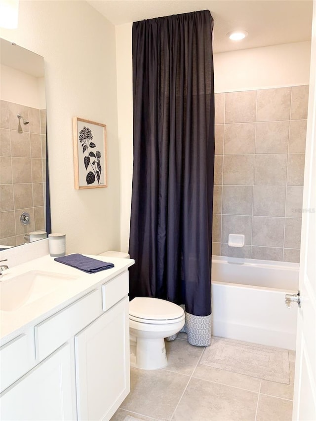 full bathroom with toilet, shower / bathtub combination with curtain, tile patterned floors, and vanity