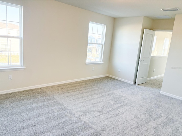 unfurnished room with light colored carpet