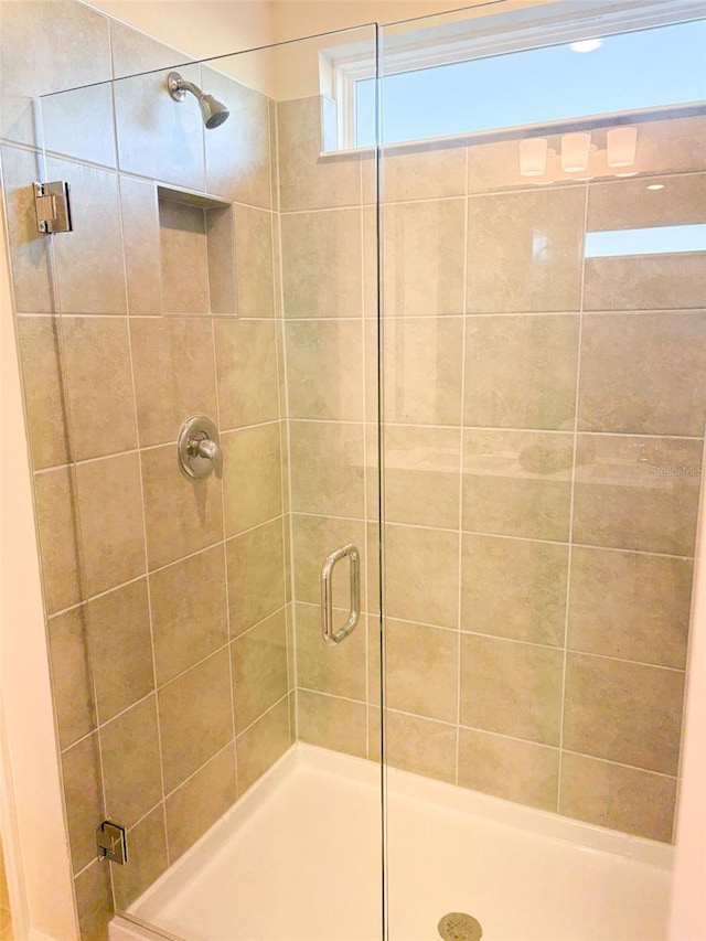 bathroom featuring walk in shower