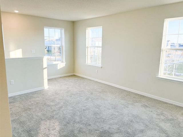 spare room with light carpet