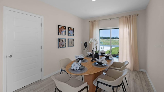 dining area with light hardwood / wood-style flooring