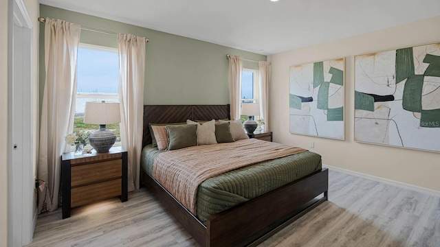 bedroom with light hardwood / wood-style flooring