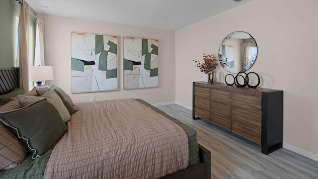 bedroom with light hardwood / wood-style flooring