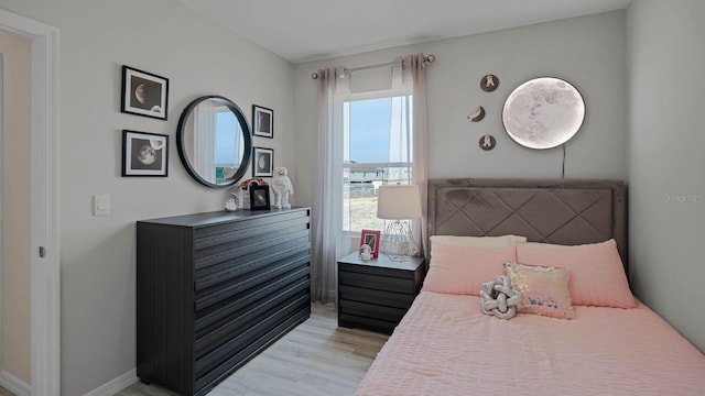 bedroom with light hardwood / wood-style floors