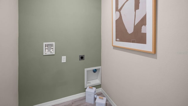 clothes washing area featuring electric dryer hookup, wood-type flooring, and washer hookup