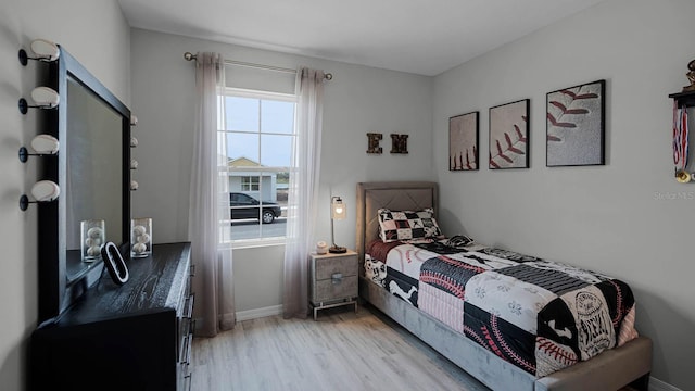 bedroom with light hardwood / wood-style flooring