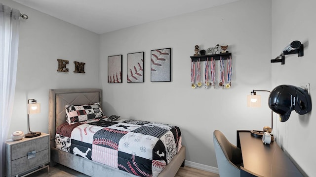 bedroom with light wood-type flooring