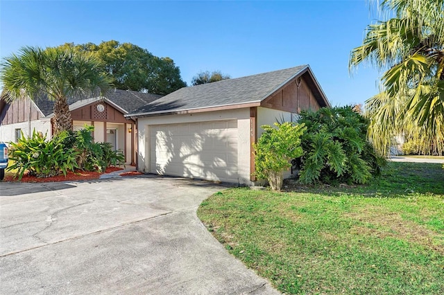 ranch-style house with a front yard and a garage