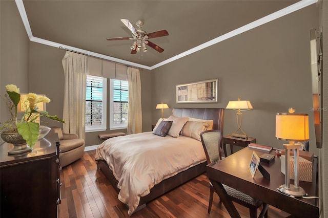 bedroom with dark wood-type flooring, ceiling fan, and ornamental molding