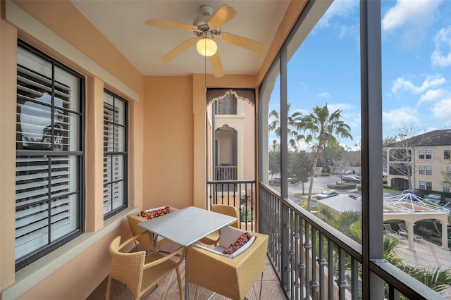 balcony featuring ceiling fan