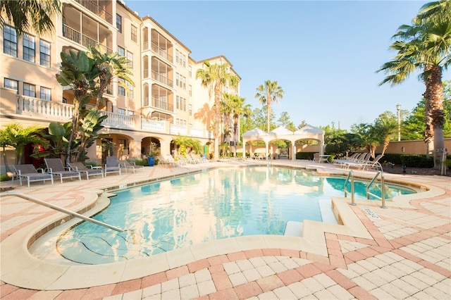 view of swimming pool with a patio