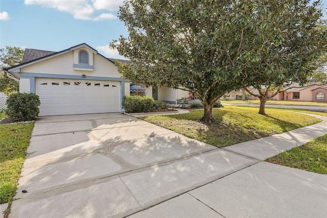 view of front facade featuring a front lawn and a garage