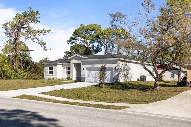 view of front facade featuring a garage, central AC, and a front lawn