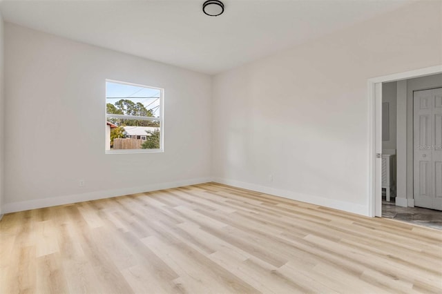 unfurnished room with light hardwood / wood-style flooring