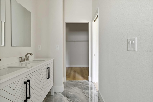 bathroom with concrete floors and vanity