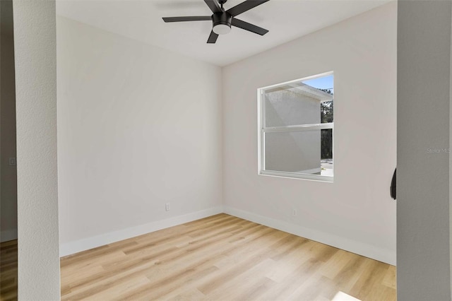 spare room featuring ceiling fan and hardwood / wood-style floors