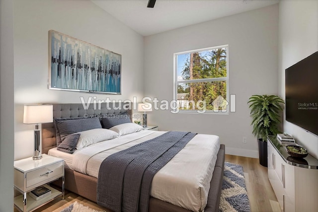 bedroom featuring ceiling fan and light hardwood / wood-style floors