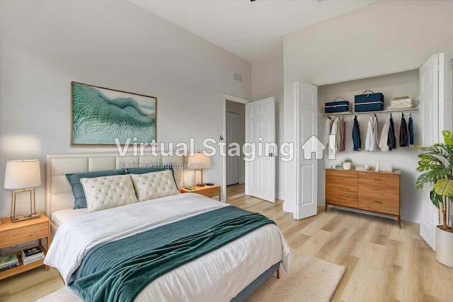 bedroom featuring a closet and light hardwood / wood-style flooring