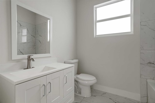 bathroom with toilet, tiled shower, a wealth of natural light, and vanity