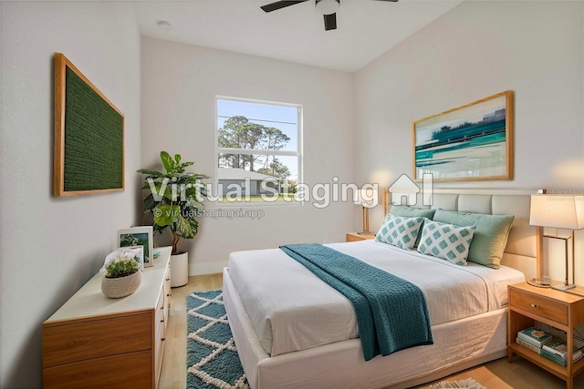 bedroom featuring ceiling fan and light wood-type flooring