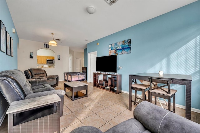 living room with tile patterned floors