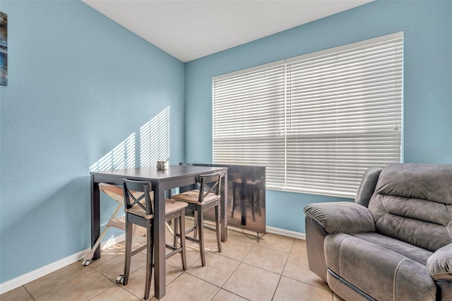 dining room featuring a wealth of natural light and light tile patterned floors