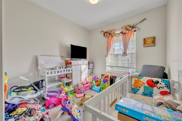 bedroom with carpet flooring and a crib