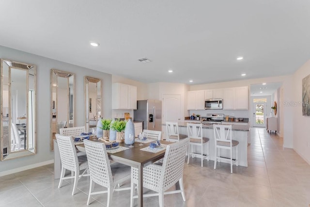 dining area with light tile patterned floors