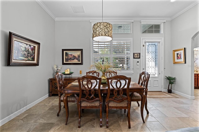 dining space featuring ornamental molding