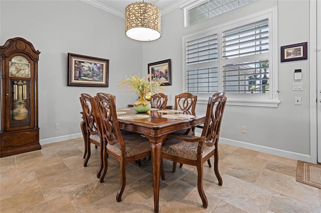 dining area featuring ornamental molding