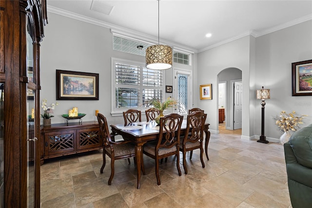 dining space with ornamental molding