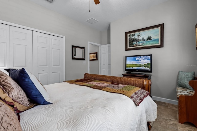 bedroom featuring ceiling fan and a closet