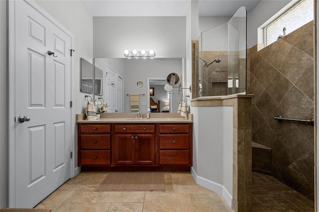 bathroom featuring vanity and a tile shower