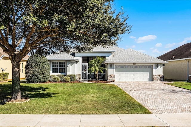 view of front of property with a garage and a front yard