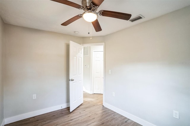 unfurnished bedroom featuring light wood-type flooring and ceiling fan