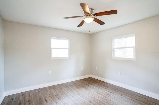 unfurnished room featuring ceiling fan and hardwood / wood-style flooring