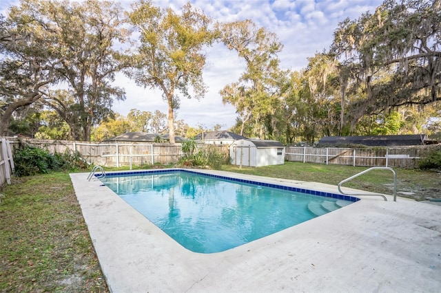 view of pool with a yard, a storage unit, and a patio