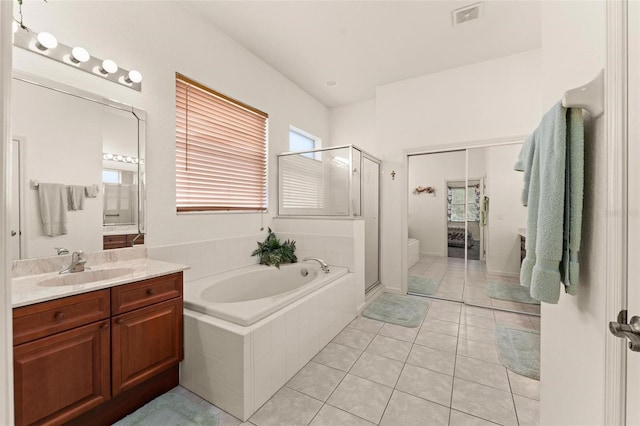 full bathroom with toilet, tile patterned floors, vanity, and independent shower and bath