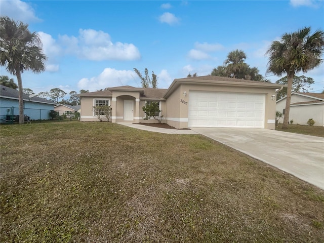 ranch-style house with a garage and a front lawn