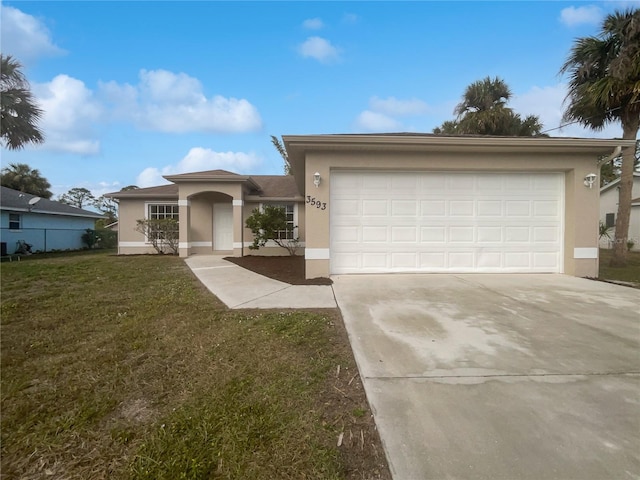 view of front of property with a front lawn and a garage