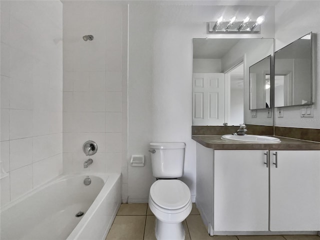 full bathroom featuring toilet, tiled shower / bath combo, tile patterned flooring, and vanity