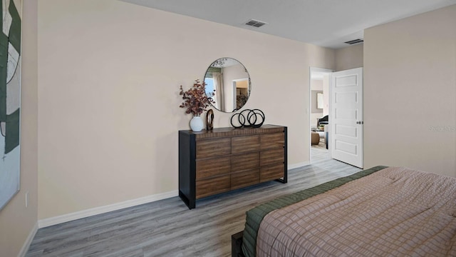 bedroom with light wood-type flooring