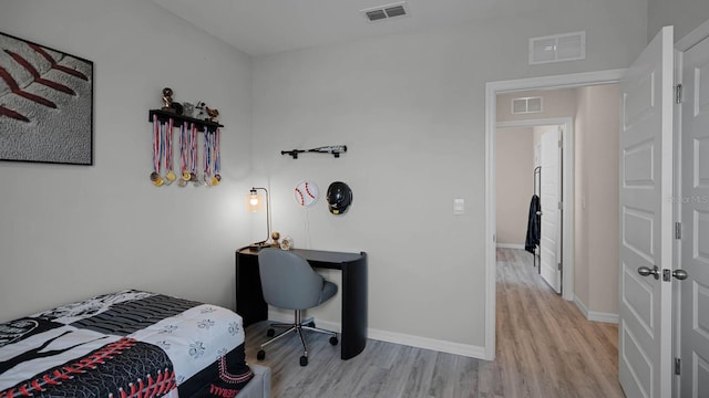 bedroom with light hardwood / wood-style floors