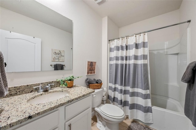 full bathroom with vanity, toilet, and shower / bath combo