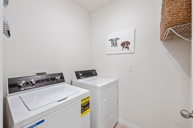 laundry area featuring separate washer and dryer