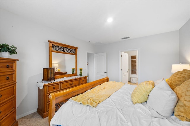 bedroom with light colored carpet