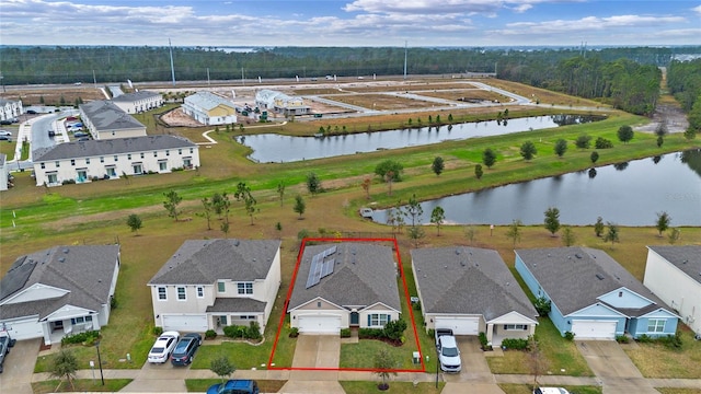 bird's eye view with a water view