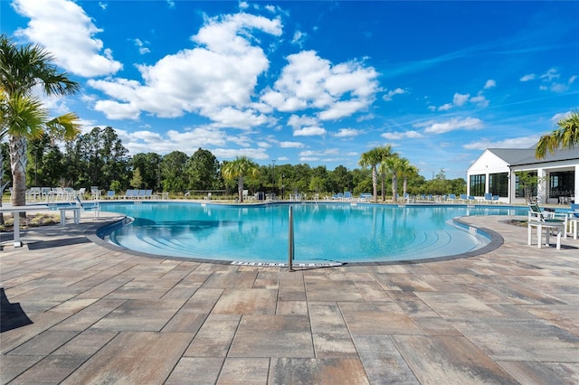 view of pool featuring a patio area