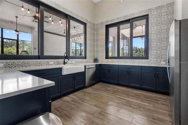 bathroom with sink, hardwood / wood-style floors, and backsplash