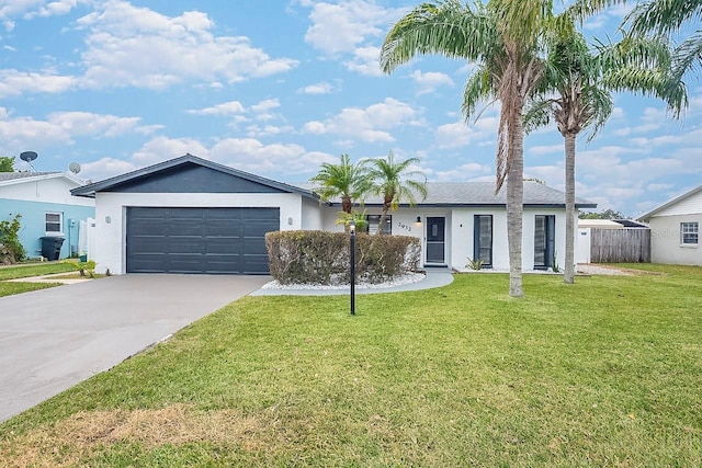 ranch-style home with a garage and a front yard